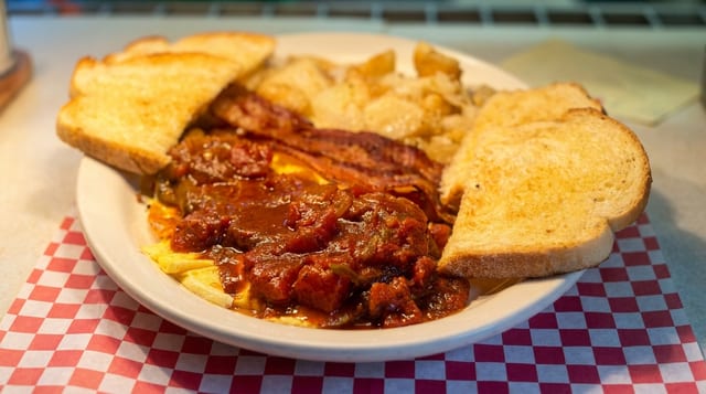 Huevos Rancheros: 2 Eggs w/Ranchero Sauce, Home-fries, Toast & Jelly.